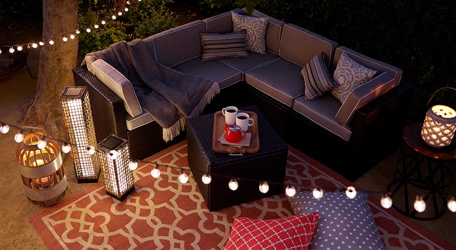 Hygge style. Danish for enjoying cozy times with loved ones, Hygge is the perfect word for fall nights. Set the scene with some easy outdoor updates: lots of comfy pillows, a rug underfoot & sparkling lights all around.  